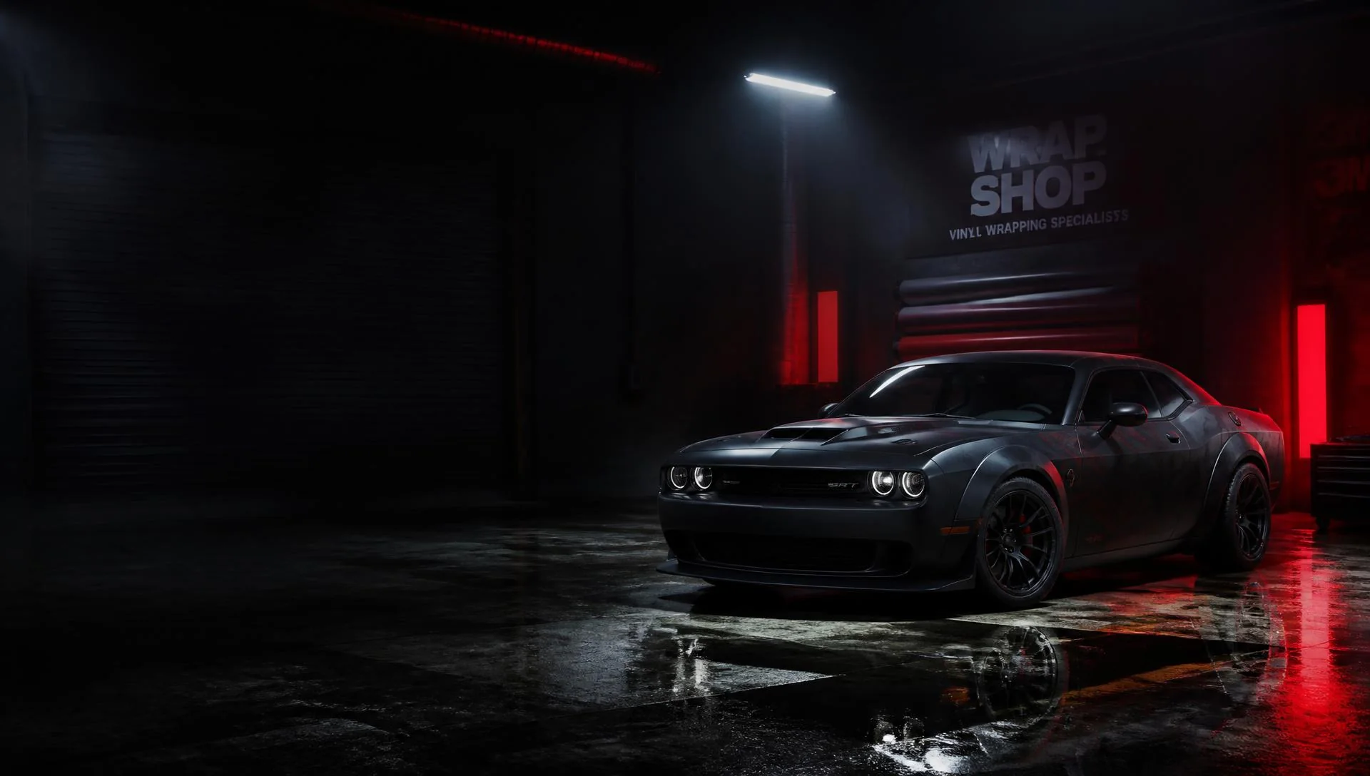 Matte black wrapped muscle car inside the RAD Wrapz Garage vinyl wrap shop in Conway, Arkansas