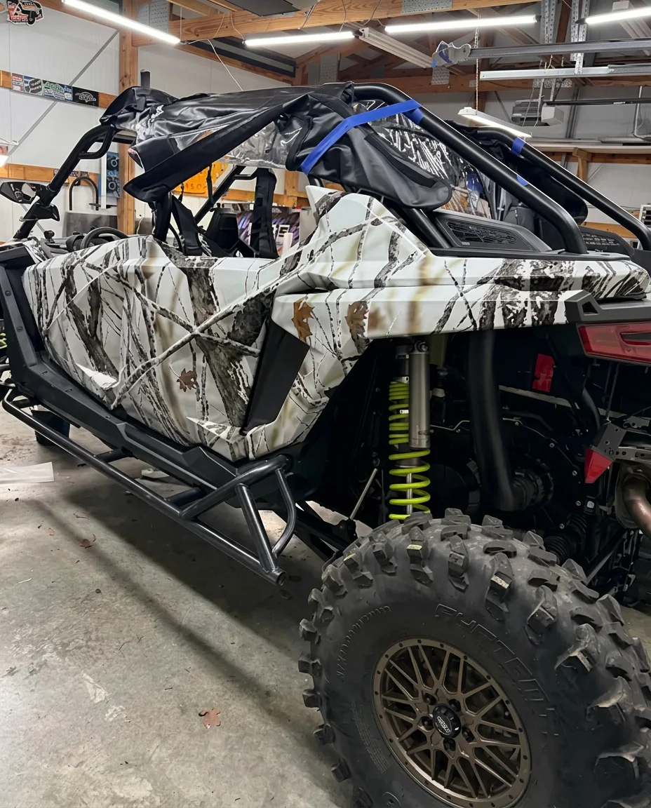 Snow camo vinyl wrap on a Polaris RZR side-by-side in Central Arkansas